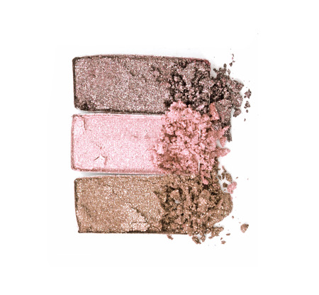 Glitter eyeshadow palette crushed on white.の写真素材