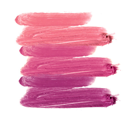 Collection of smudged lipsticks isolated on whiteの写真素材