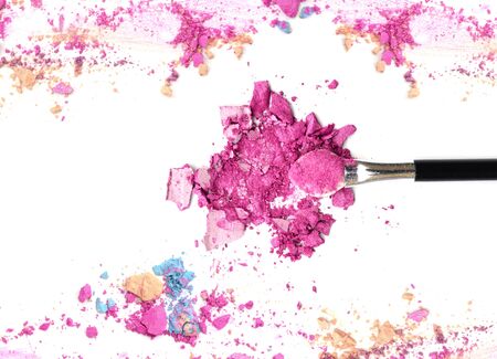 Close up of crushed blush on white background and cosmetic brushの写真素材