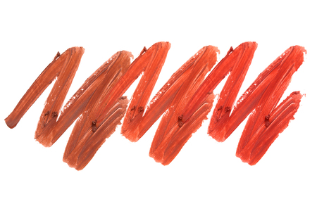 Collection of smudged lipsticks isolated on whiteの写真素材