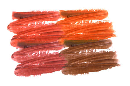 Collection of smudged lipsticks isolated on whiteの写真素材