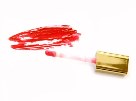 Lipgloss and smudged lipsticks on white backgroundの写真素材