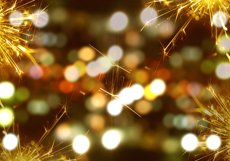 Sparkler fire with bokeh background at nightの写真素材