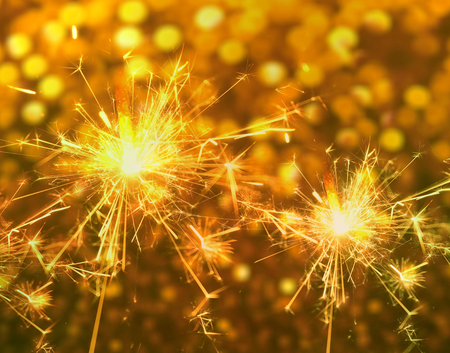 Sparkler close up on bokeh background.の写真素材