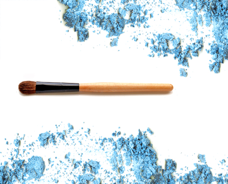 Cosmetic brush on crushed make up blue eye shadowの写真素材