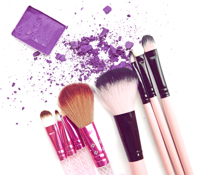 Eyeshadow in box and crushed samples isolated with brush make upの写真素材