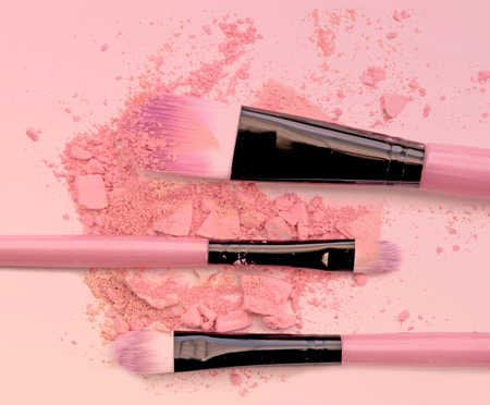 Brush make up set crushed make up power on pink background.の写真素材