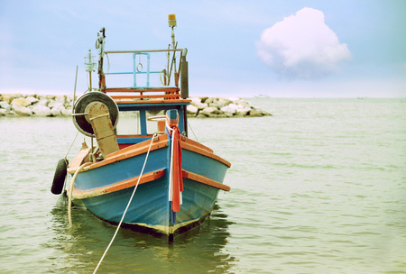 Thai fishing boat used as a vehicle for finding fish in the seaの写真素材
