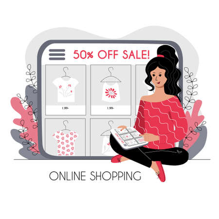 Online shopping concept. The girl is sitting and choosing clothes on the store website on the...