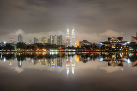 Nightscape scene of Kuala Lumpur city with reflection at the lakeのeditorial素材