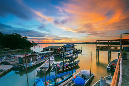 Sunset scene at Fisherman Village with fishing boatsのeditorial素材