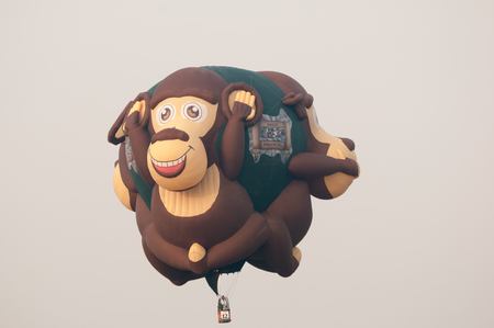PUTRAJAYA, MALAYSIA - 31 March 2013 : Shane Robinson USA with monkeys shape balloon performed at 5th Putrajaya International Hot Air Balloon Fiesta 2013のeditorial素材