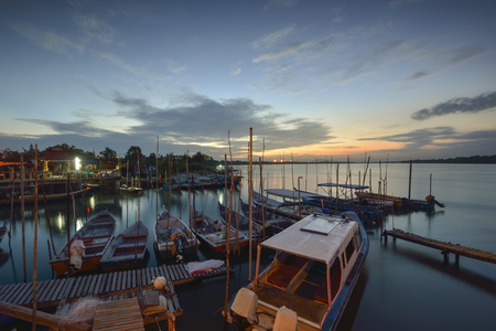 Early Morning with boats at the lagoon. Slight motion blur on the boat due to long exposure.の写真素材