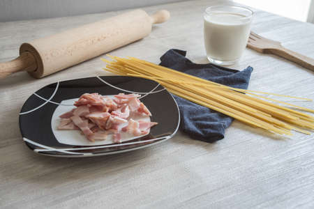 spaghetti to bacon and egg for dinner on porcelain plateの写真素材