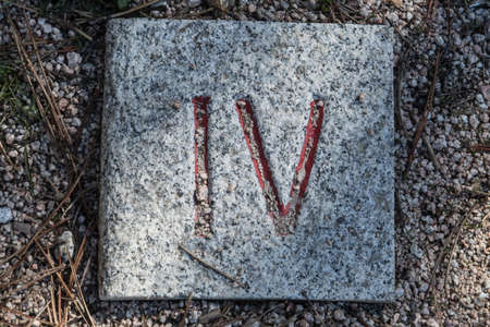 Roman numerals engraved on square granite stonesの写真素材
