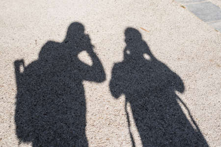 two names of people taking picturesの写真素材