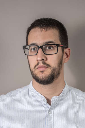 portrait of brown hair man with glasses