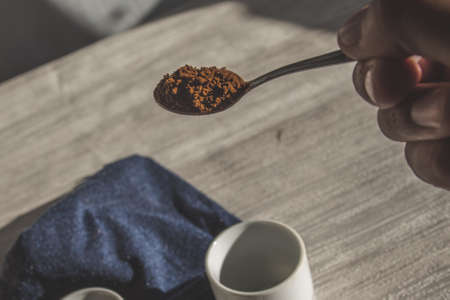 Instant coffee granules scattered brown close up.の写真素材