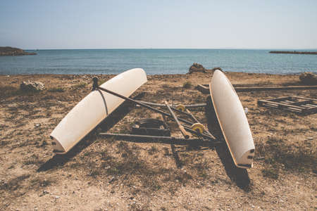 Abandoned wooden boat on the beach