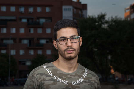 portrait of young man with glasses and beard