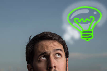 Portrait of young man with idea expressionの写真素材