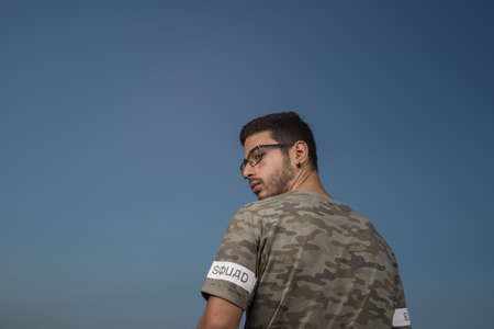 portrait of young man looking backの写真素材