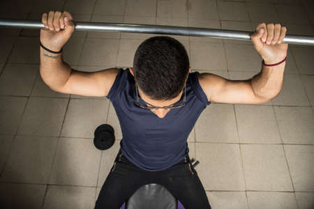 Man exercising with dumbbells, shoulder exerciseの写真素材
