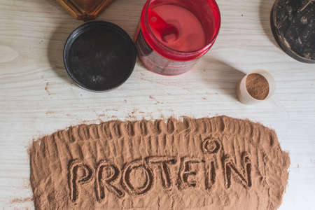 Spoonful of whey protein, with the word protein written. Sport Nutrition.の写真素材