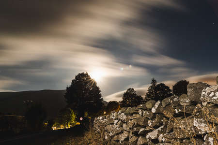 stones in the mountain at night with a dark night sky