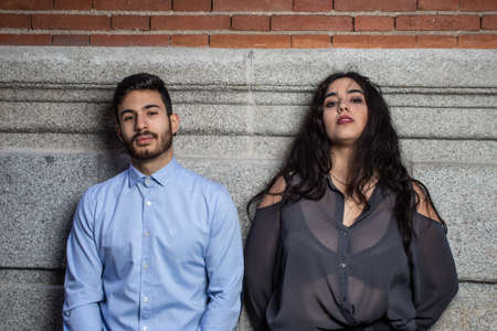 young dark skinned women in stone wallの写真素材