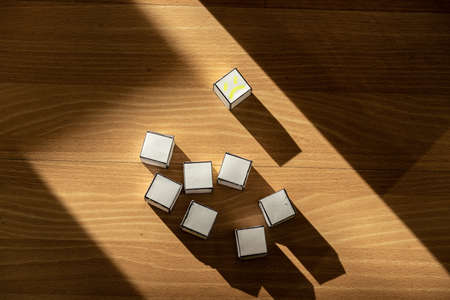Top view of blank paper boxes, with a sad and displaced face.の写真素材