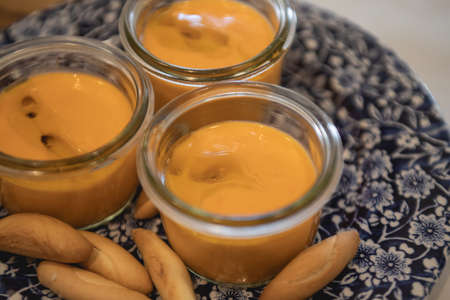 Rich Spanish salmorejo dish, with olive oil and bread spikes.