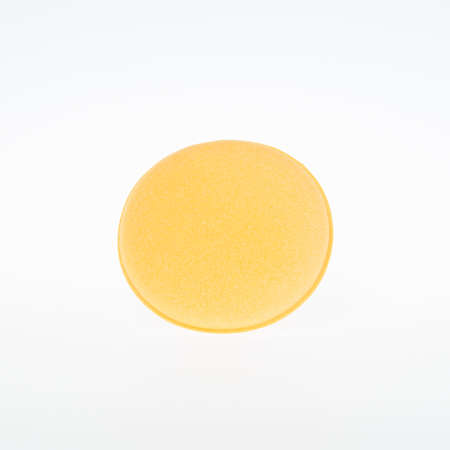 closeup round sponge isolated  whiteの写真素材