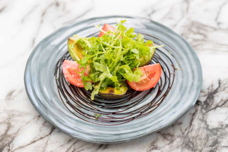 Cilantro tomato avocado on marbleの写真素材