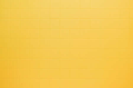 Yellow tiles on the wallの写真素材