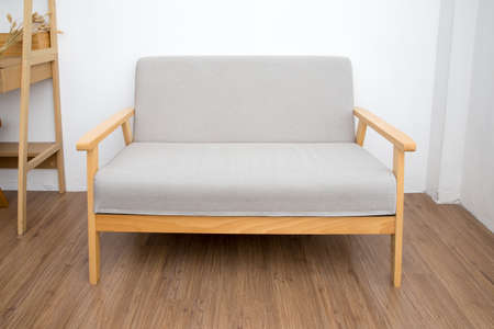 room with gray sofa wooden floorの写真素材