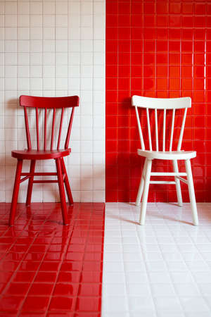 white / red chair on tile backgroundの写真素材