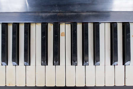 keyboard from an old broken and damaged pianoの写真素材