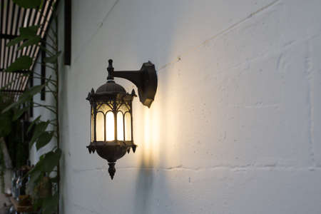 Close up old vintage wall lamp on Concrete wallの写真素材