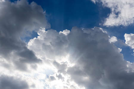 blue sky with clouds and light ray