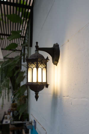 Close up old vintage wall lamp on Concrete wall