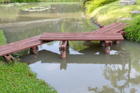 small wooden bridge in the park