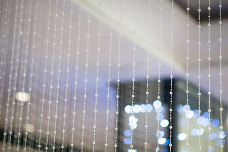 Strings of crystal from ceiling interiorの写真素材