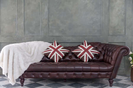 Brown leather Luxurious sofa with pillow and white woolの写真素材