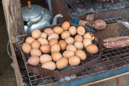 Roasted Egg on stove, Thai street food.の写真素材