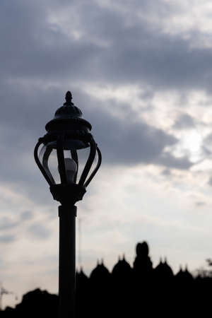 close up of street light pole with sunset sky.の写真素材