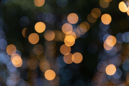 Abstract orange and white lights bokeh background.