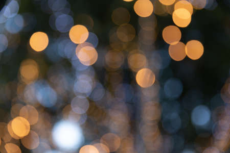 Abstract orange and white lights bokeh background.の写真素材