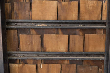 pieces of wooden plank wall with steel shelves.