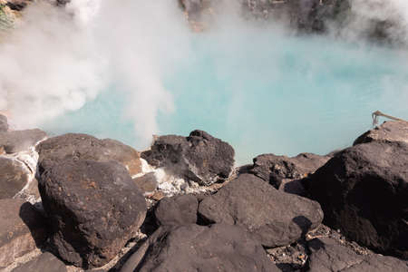landscape view of blue hot springs and stone at Japan.の写真素材